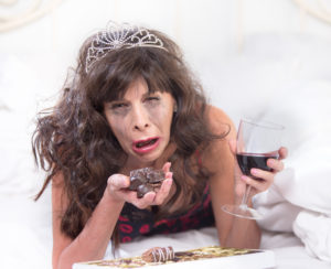 Sobbing mature woman wearing a tiara crying and tired of being alone